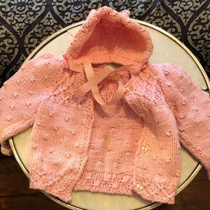 Hand knitted baby sweater with hat with kitty ears.